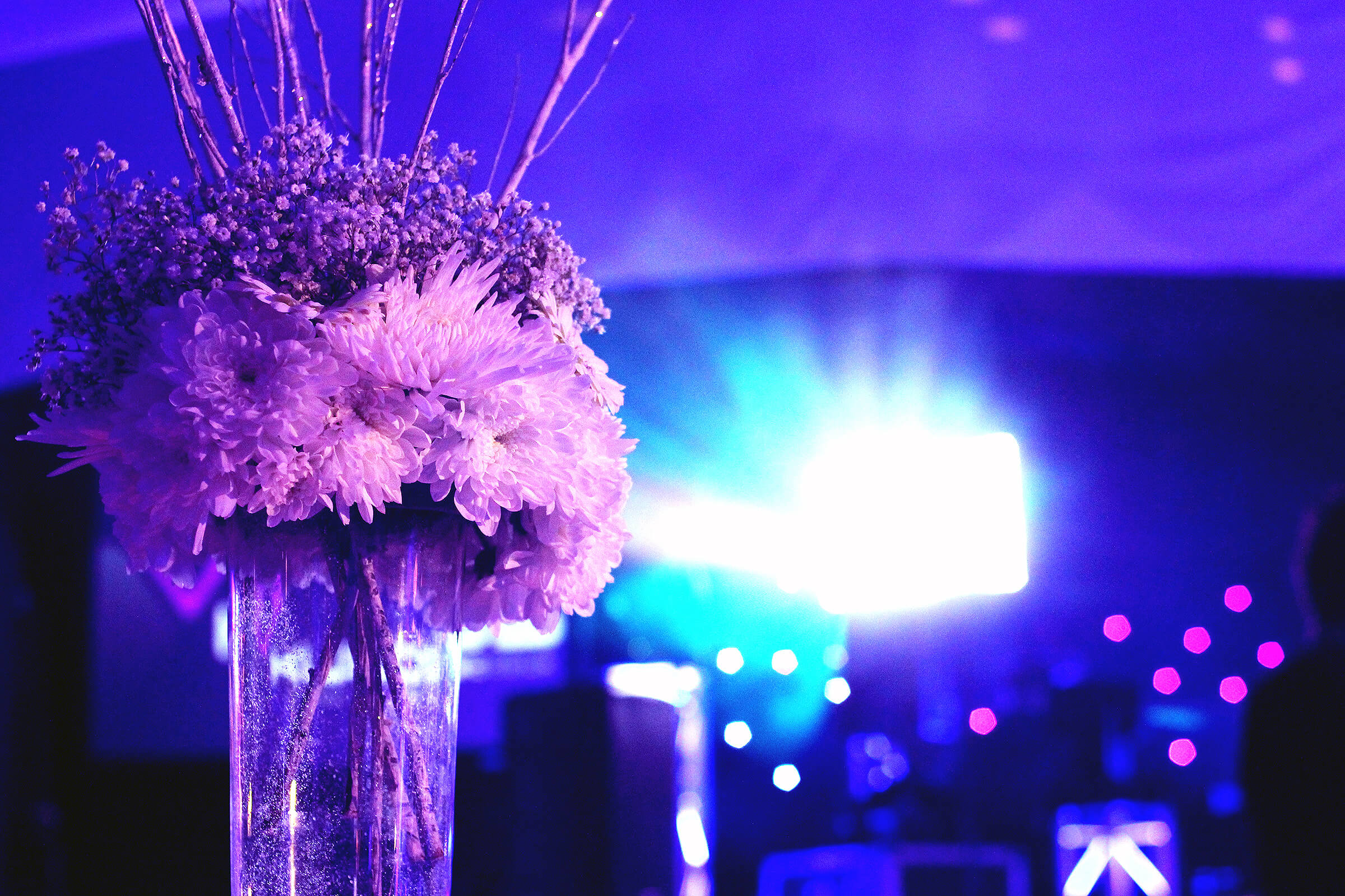 Close shot of flower table decor of evening wedding reception